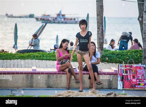 Anorexic Looking Thai Ladyboy Freelancer Sex Worker Posing Holding Handbag On Beach Road