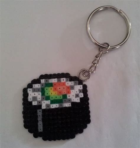 A Keychain Made To Look Like An Old School Computer Game Character