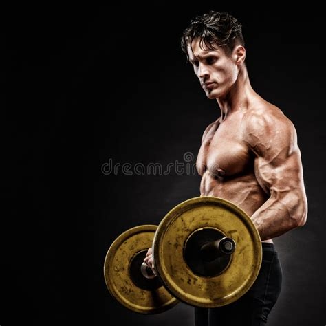 Closeup Portrait Of A Muscular Man Workout With Barbell At Gym Stock