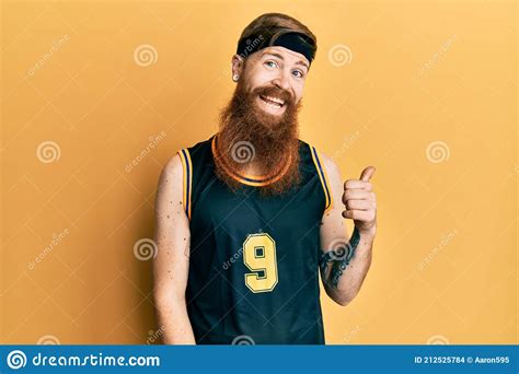 Redhead Man With Long Beard Wearing Basketball Uniform Smiling With