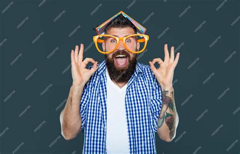 Premium Photo Funny Bearded Man In Party Glasses With Book On Head Ok