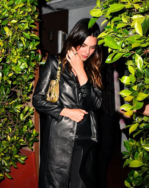 Kendall Jenner nearly spills out of skintight leather top on LA date ...