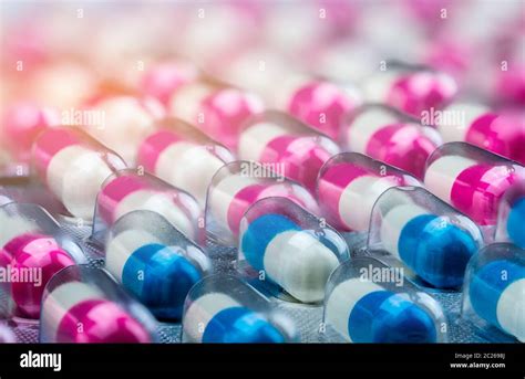 Closeup Pink White And Blue White Antibiotics Capsule Pills In Blister