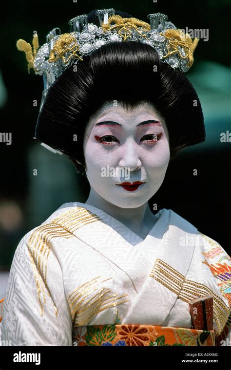 A Japanese Geisha Poses In Her Traditional Outfit In Tokyo Japan Stock