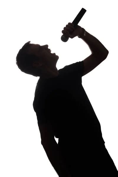 Hombre cantando silueta fotos de stock imágenes de Hombre cantando