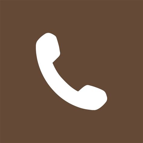 A White Phone Icon On A Brown Background