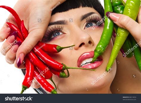 Spicy Lady Holding Red And Green Hot Chilli Peppers In Arms Stock Photo Shutterstock