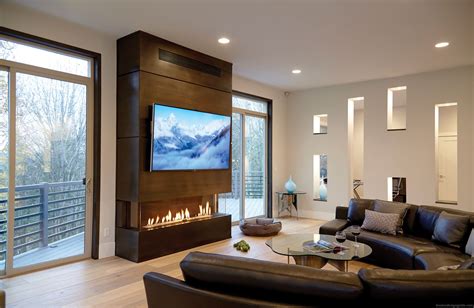 Cozy Living Room Setup With TV Over The Fireplace Built In Ortal Heat