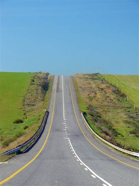 The Road Ahead A Stright Road Up A Hill Stock Photo Image Of Road