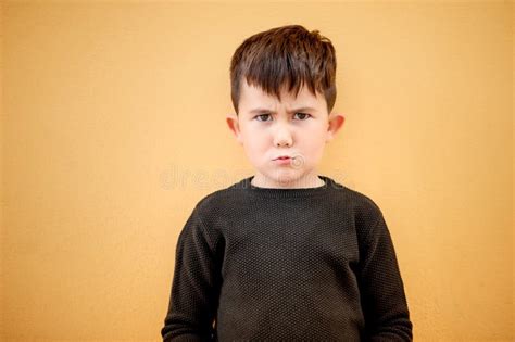 cute boy   grumpy stock image image  furious