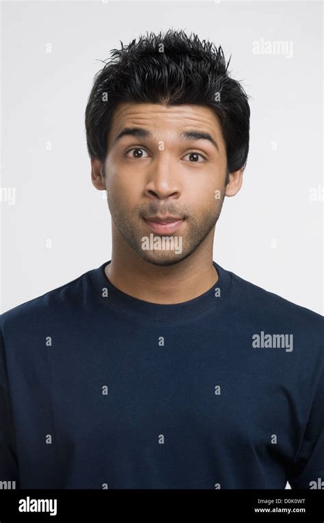 Man Looking Surprised With His Raised Eyebrows Stock Photo Alamy