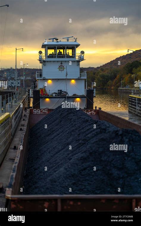 A Towboat Transports A Barge Of Coal Through A Lock Chamber At Montgomery Locks And Dam