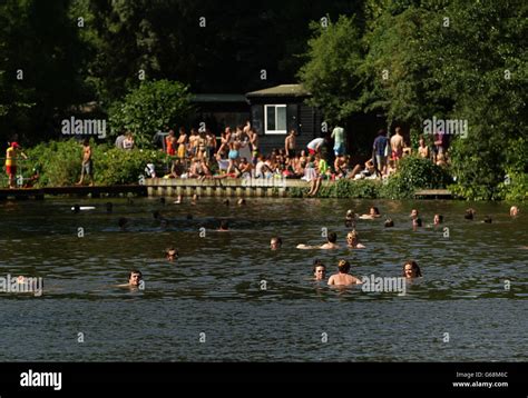 Swimmers And Sunbathers Enjoying The Hot Weather In The Mixed Bathing