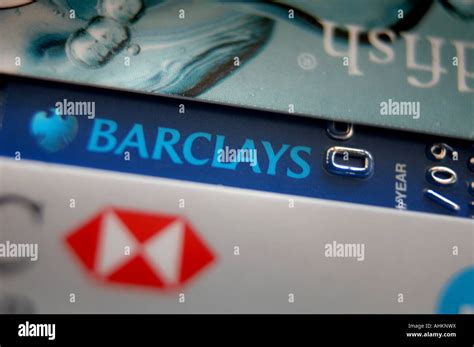 A Barclays Bank Debit Card With A Hsbc Credit Card And A Goldfish