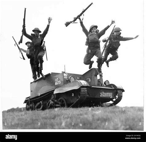 Action Men Of The Green Howards Leaping From Their Bren Carrier