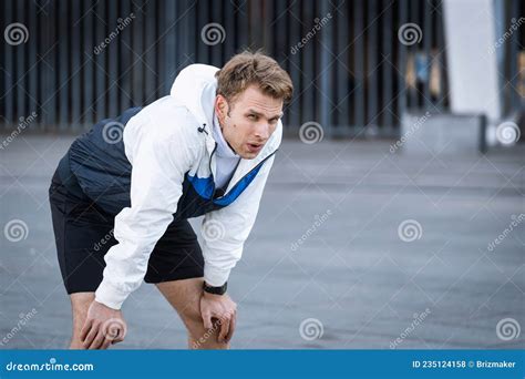 Tired Sportive Man Resting After Running In City Stock Photo Image Of