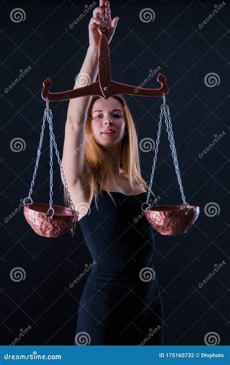 Attractive Beautiful Girl With Libra In Hand As Symbol Of The Air