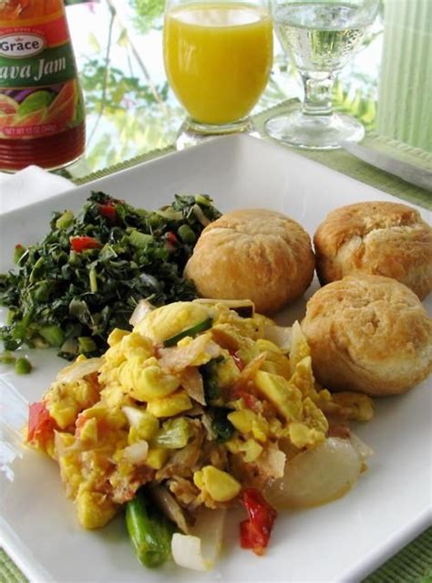 Ackee Saltfish Callaloo Fried Dumplings With A Glass Of Orange