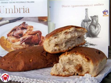 Some Bread Is Sitting On A Table Next To A Cookbook