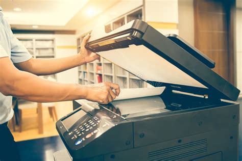 Photocopier Printer Close Up Hand Scanning Paper On The Copier Or