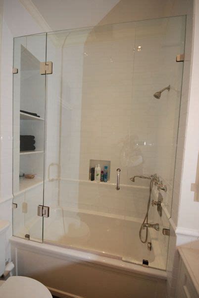 Clear Frameless Glass Encloses This Tub And Shower With A Modern Look