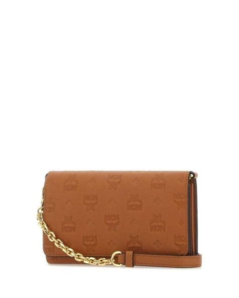 Mcm Aren Monogram Embossed Crossbody Wallet In Brown Lyst