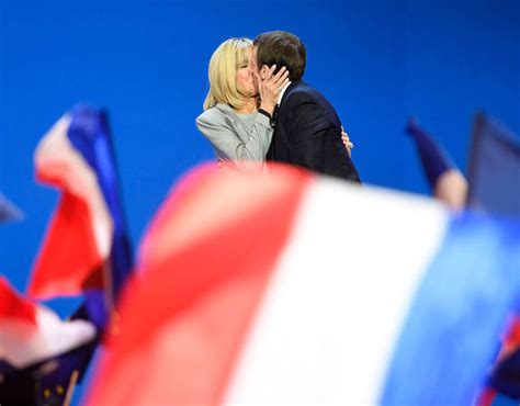 Emmanuel Macron Kissing His Wife Brigitte Trogneux On Stage At The Parc Des Expositions In Paris