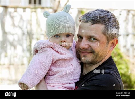 Dad With Cute Baby Girl Outside In Spring Stock Photo Alamy