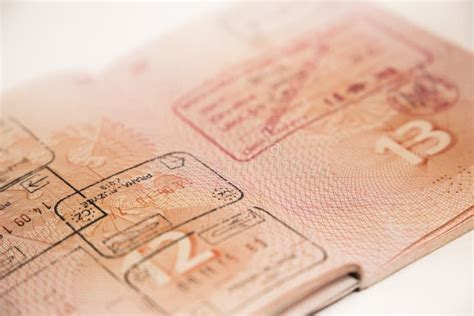 Passport With Cross Border Stamp And Visa Editorial Stock Photo