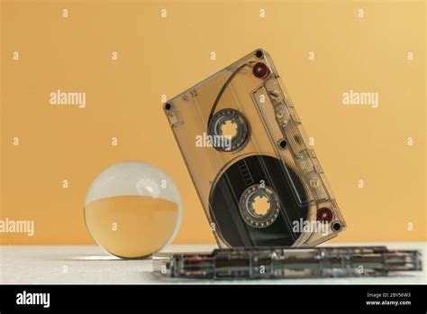 Beautiful Audio Cassettes Tape On A White Table And Yellow Space