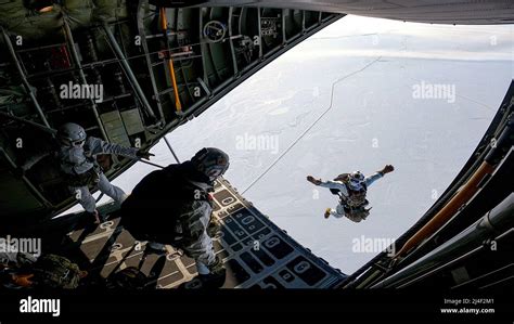 Naval Special Warfare Members Perform A High Altitude Low Opening Jump