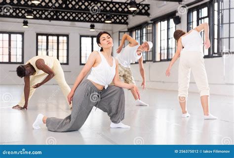 Four Dancers Doing Breathing Practice Stock Photo - Image of exercising, placid: 256375012