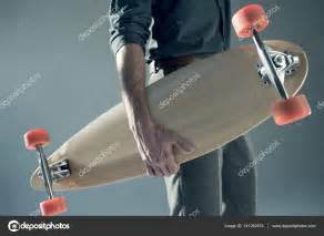 Stylish Man Holding Skateboard Stock Photo Arturverkhovetskiy