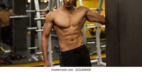 Athletic Young Man Doing Physical Exercise Stock Photo 2122208408