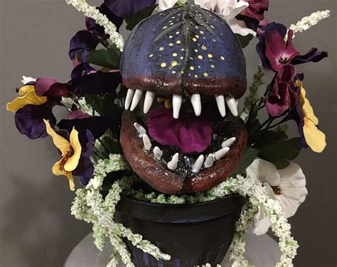 Audrey Ii Inspired Venus Fly Trap With Purple Pansies And Vined