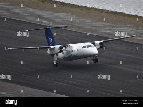 Air Iceland Connect Dash8 200 taking off from Isafjördur airport Stock