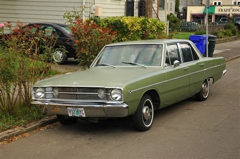 OLD PARKED CARS.: 1968 Dodge Dart Sedan.