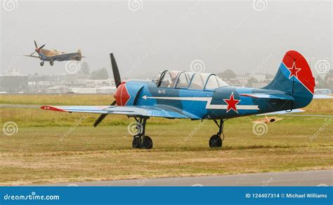 A Blue And Red Yak 52 Trainer Aircraft On The Ground Editorial Stock