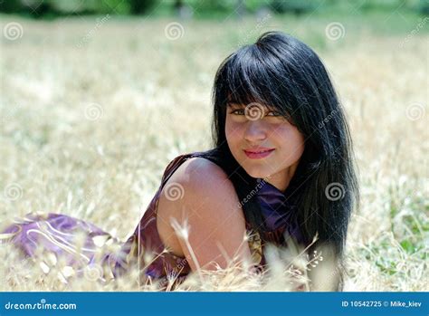 Brunet Woman Lying In Grass Stock Image Image Of Hair Lily 10542725