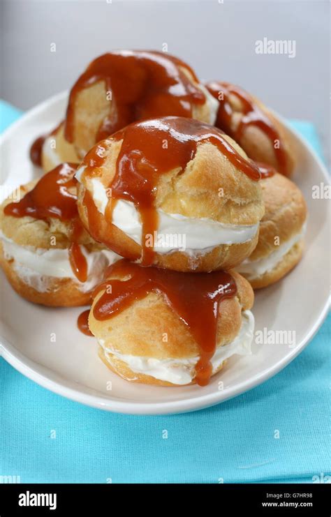 Profiteroles with cream caramel sauce Stock Photo - Alamy