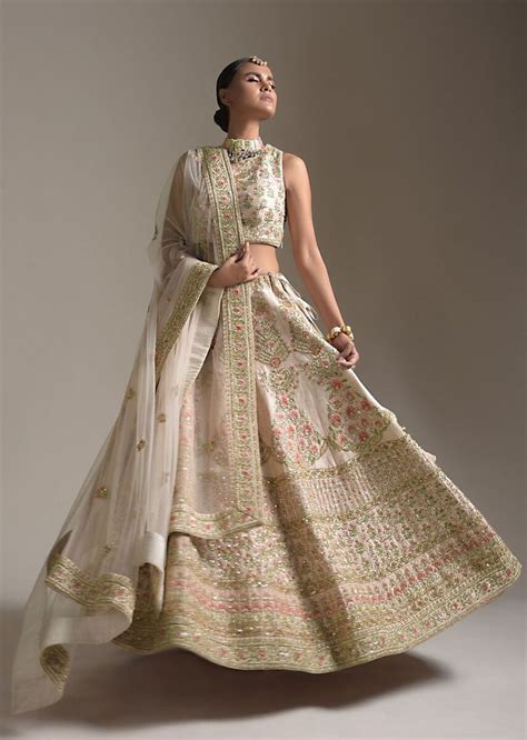 Creamy Pink Lehenga Choli In Raw Silk With Pink Resham And Zardosi Embroidered Floral Kalis