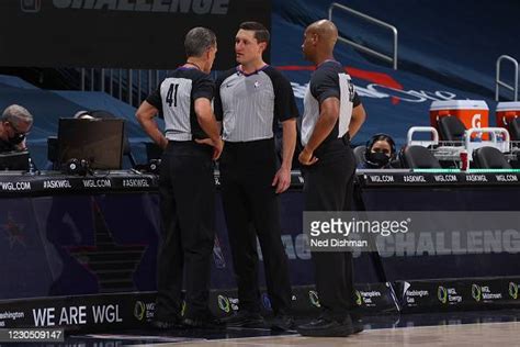 Referees Talk During The Miami Heat Game Against The Washington News