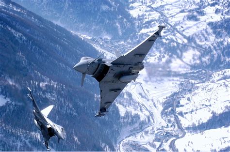 Two Eurofighters Practicing Maneuvers In The Italian Alps Aircraft