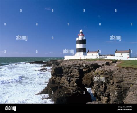 Old Th Nineteenth Century Hook Head Lighthouse On Cliffs Seen From