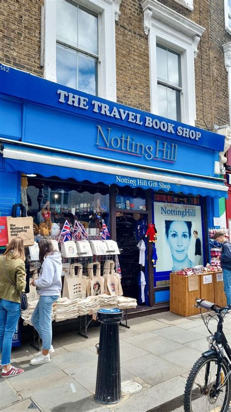 People Are Standing Outside The Travel Book Shop In Notting Hill