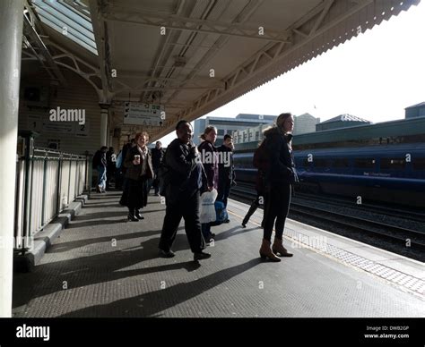 Rail Passengers Waiting For Train On The Platform At Cardiff Central