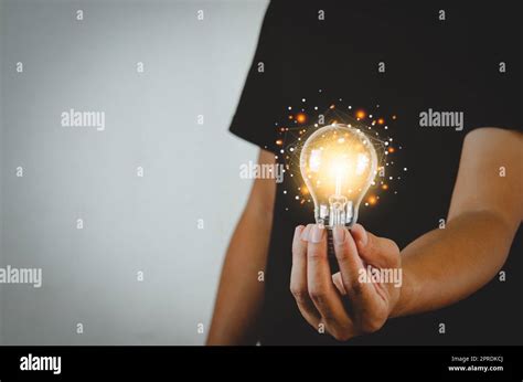 Man Holding Light Bulbs Ideas Innovation Technology And Creative