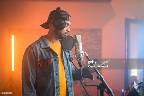 Young Hip Hop Singer Recording Music In Recording Studio High Res Stock