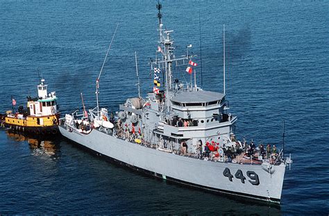 The Ocean Minesweeper Uss Impervious Mso 449 Is Moved To The Pier After Being Unloaded From