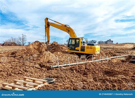 Excavator Dig The Trenches At A Construction Site Trench For Laying